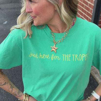 woman wearing for the tropes tee