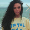model wearing by the sea tee