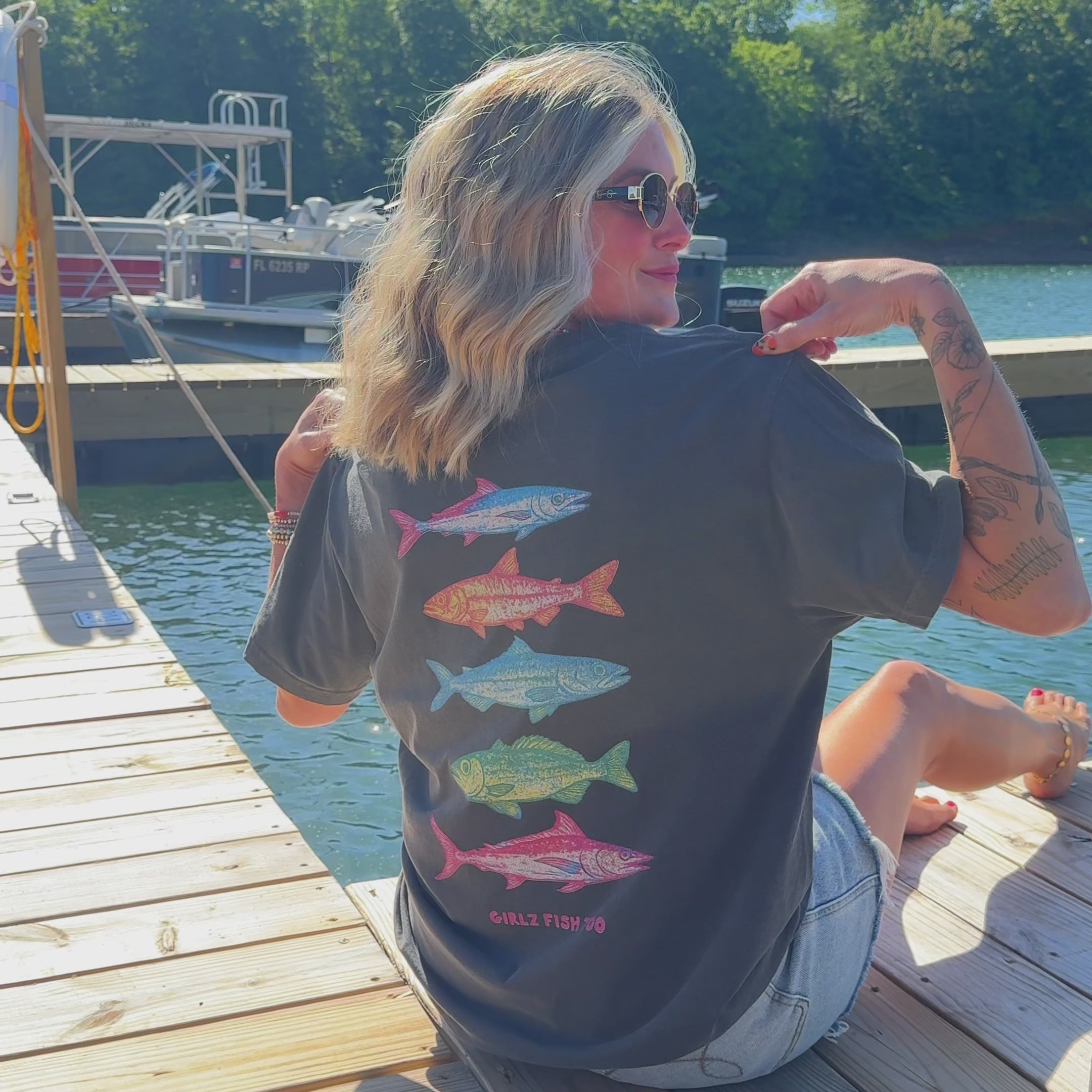 woman wearing reel it in shirt